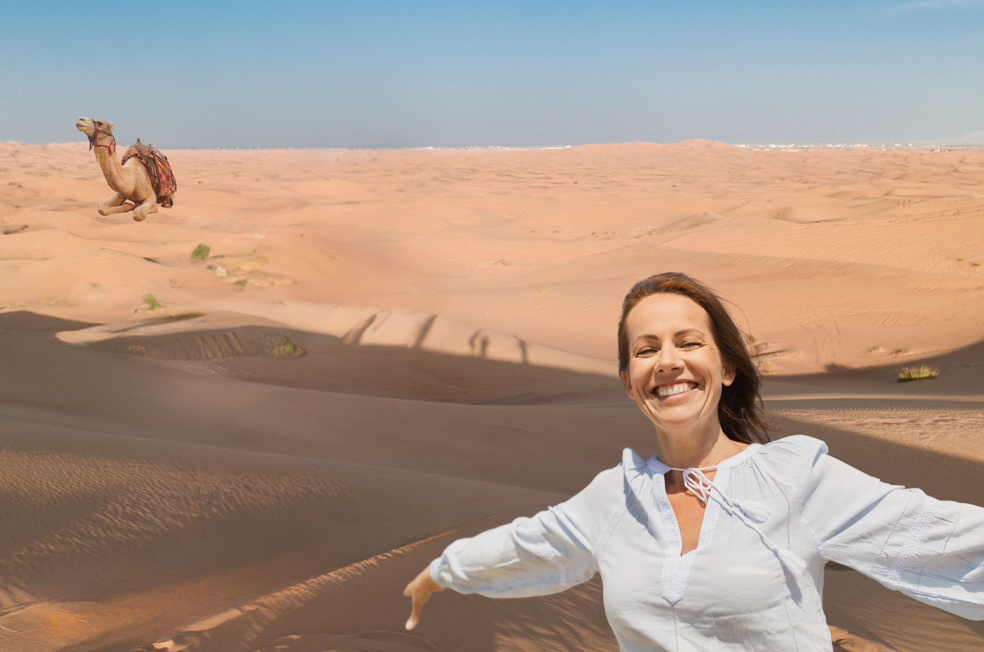 woman taking a photo in dubai desert